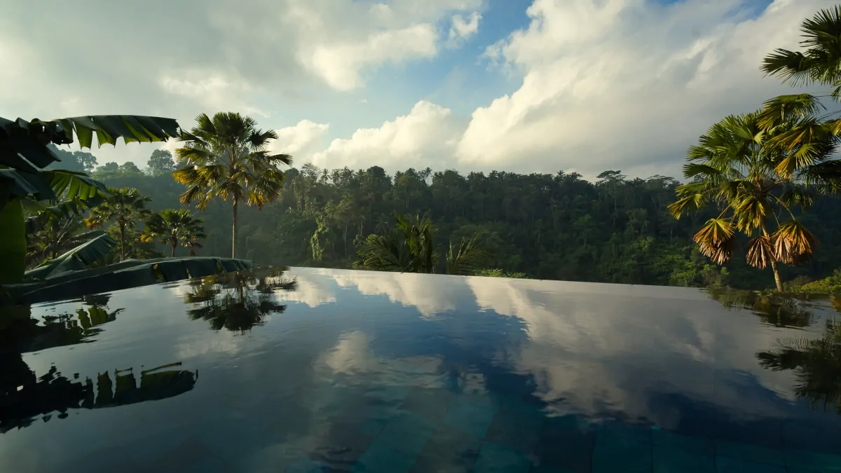Hanging Gardens Bali infinity pool overlooking jungle valley Ubud luxury experience