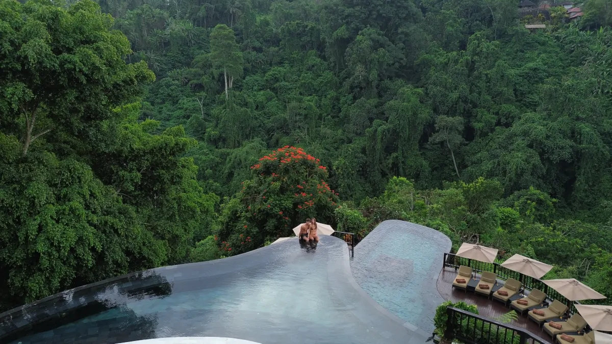 infinity pool jungle immersion Ubud Bali seamless environment luxury stay