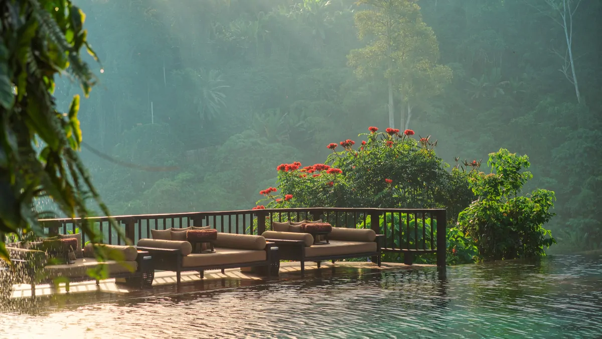 Hanging Gardens Bali infinity pool golden hour Ubud jungle valley luxury experience