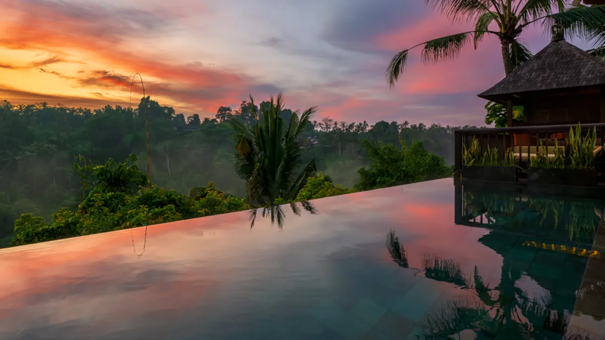 Luxury wellness retreat overlooking the rainforest in Ubud Bali at sunset